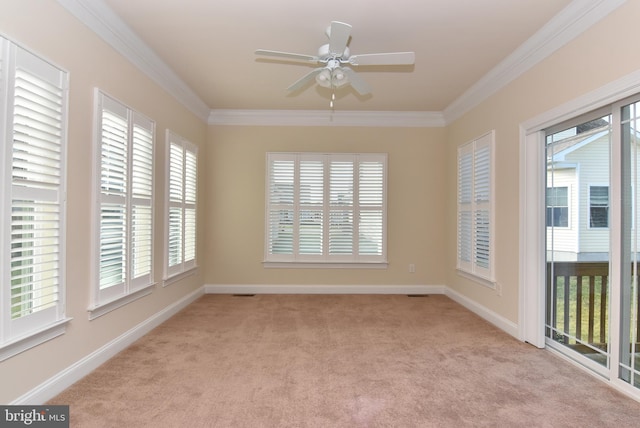 unfurnished sunroom with ceiling fan