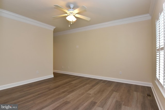 empty room featuring dark hardwood / wood-style floors, ceiling fan, and ornamental molding