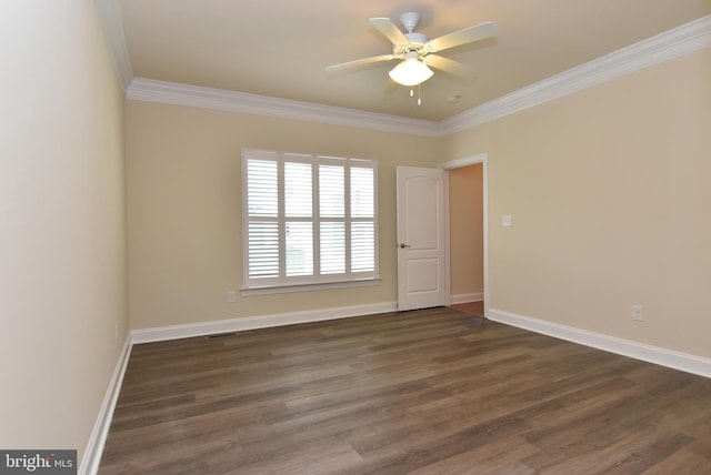 spare room featuring crown molding, ceiling fan, and dark wood-type flooring