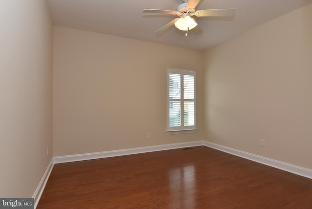 unfurnished room featuring ceiling fan and dark hardwood / wood-style floors