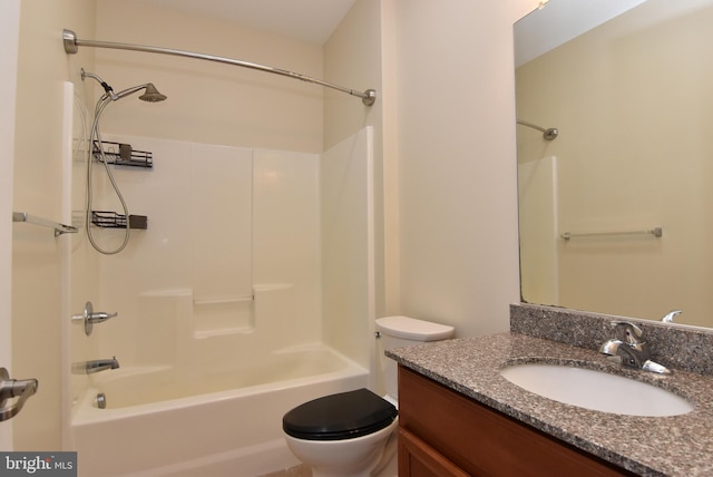 full bathroom with bathtub / shower combination, vanity, and toilet