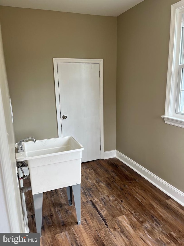 unfurnished office with dark wood-type flooring