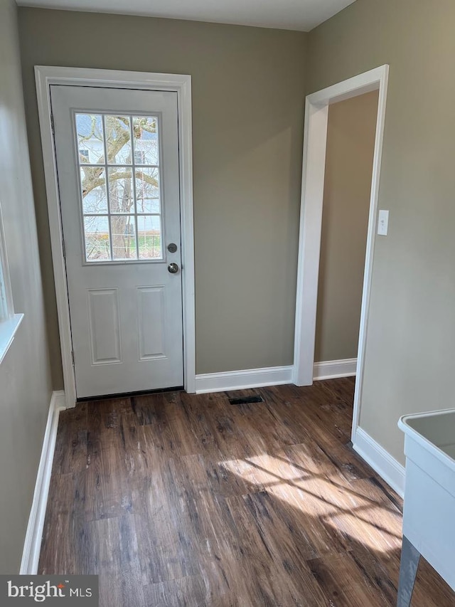 doorway to outside with dark hardwood / wood-style flooring