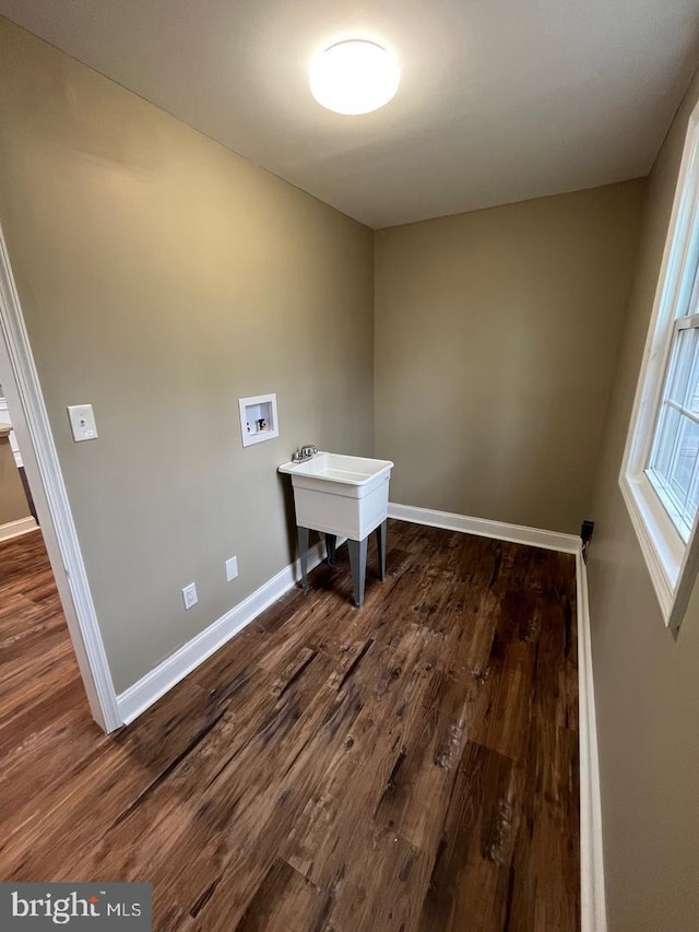 washroom with washer hookup and dark hardwood / wood-style flooring