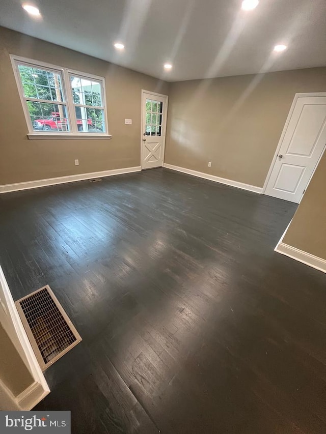 interior space with dark hardwood / wood-style flooring