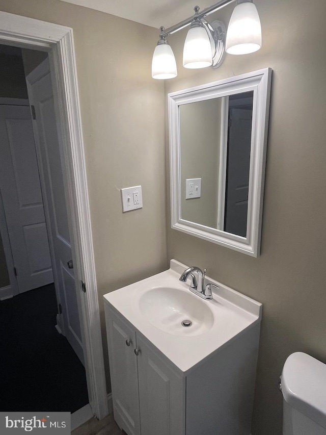 bathroom with vanity and toilet