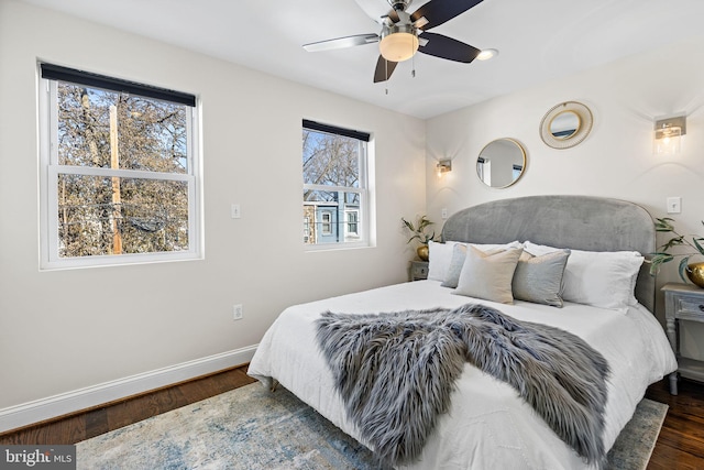 bedroom featuring ceiling fan and dark hardwood / wood-style floors