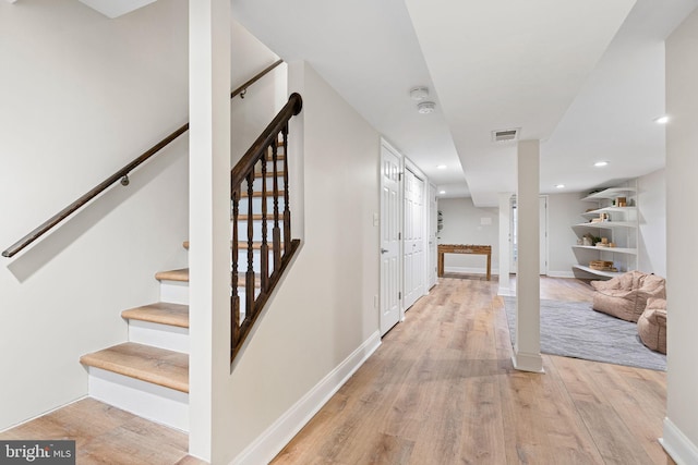 staircase featuring hardwood / wood-style flooring