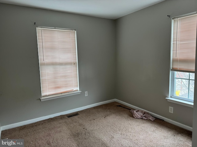 empty room featuring carpet floors