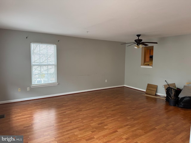 unfurnished living room featuring ceiling fan and light hardwood / wood-style floors