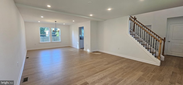 434 Redfern, Hamilton, NJ 08610 - unfurnished living room featuring stairway, wood finished floors, a chandelier, recessed lighting, and baseboards