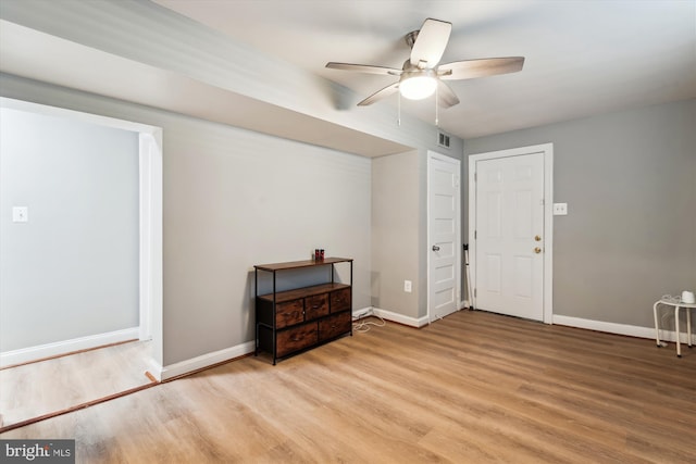 foyer entrance featuring ceiling fan and light hardwood / wood-style floors