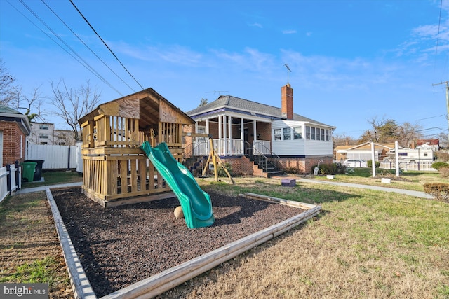 view of play area featuring a sunroom