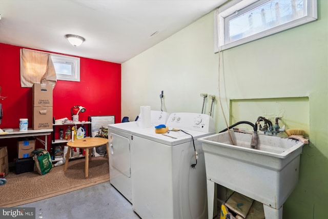 laundry area with washer and clothes dryer and sink