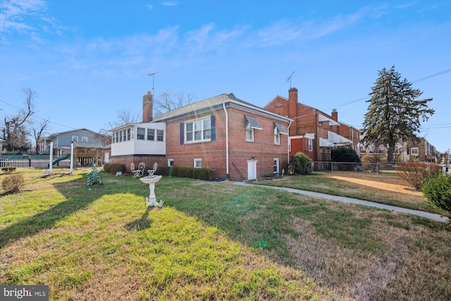 view of property exterior with a lawn