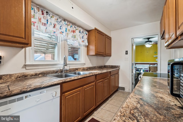 kitchen with dishwasher, light tile patterned floors, ceiling fan, and sink