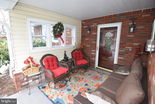 entrance to property with an outdoor hangout area