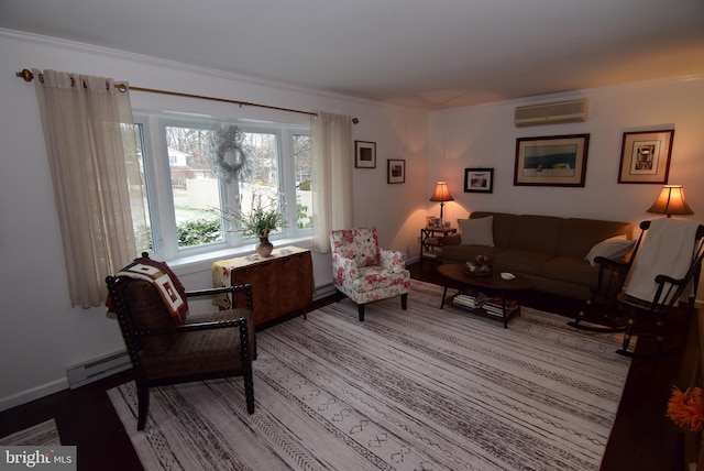 living room with an AC wall unit and a baseboard heating unit