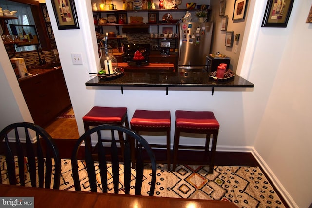 bar with stainless steel refrigerator