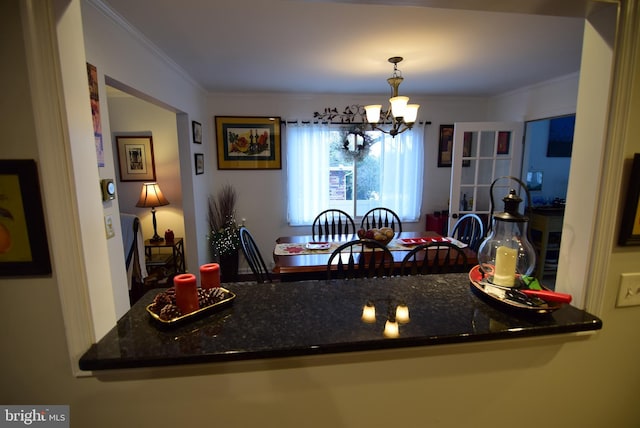 interior space featuring a notable chandelier and ornamental molding