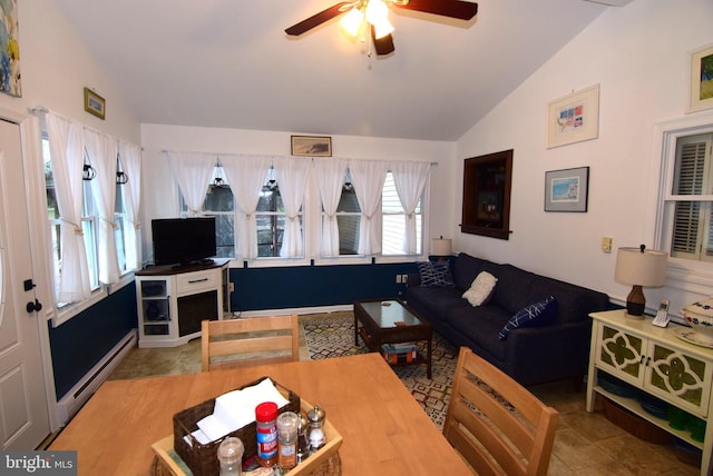 tiled living room featuring ceiling fan, lofted ceiling, and a baseboard heating unit