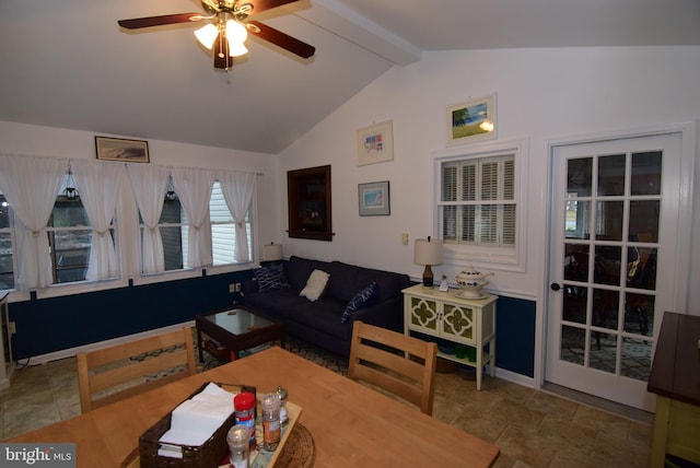 living room featuring ceiling fan and lofted ceiling with beams