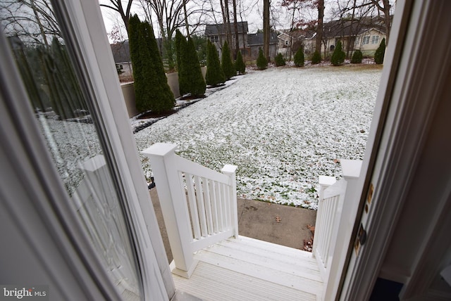 view of yard layered in snow