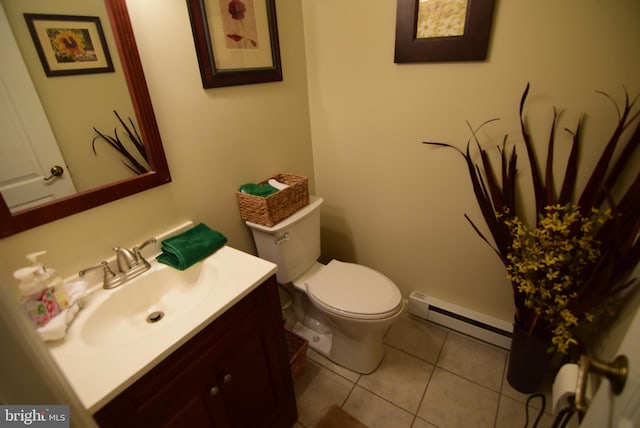 bathroom featuring tile patterned floors, vanity, toilet, and baseboard heating