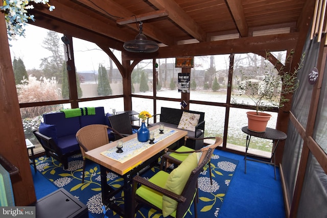 sunroom / solarium with beam ceiling and wood ceiling