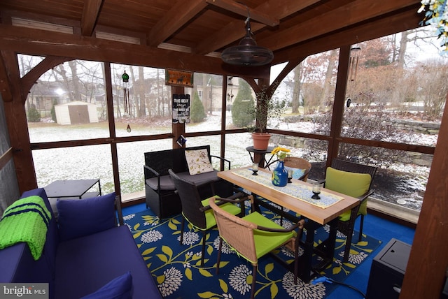 sunroom / solarium with beamed ceiling and wooden ceiling