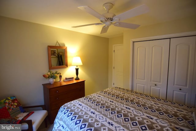 bedroom featuring ceiling fan and a closet