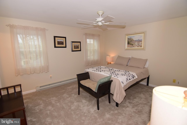 carpeted bedroom featuring ceiling fan and a baseboard heating unit