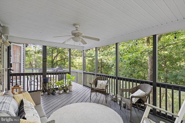 exterior space featuring ceiling fan