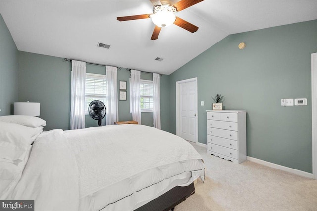 carpeted bedroom featuring ceiling fan and vaulted ceiling