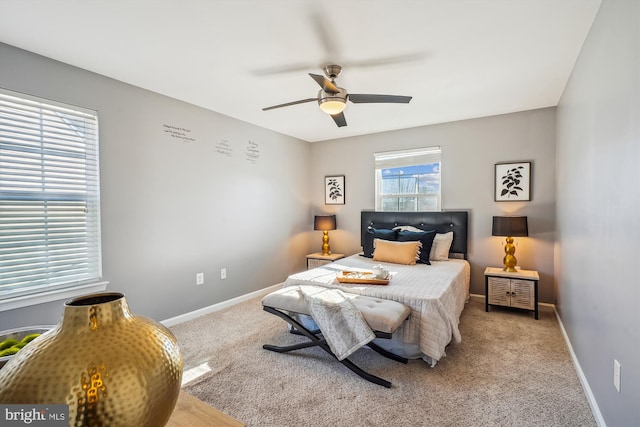 bedroom with ceiling fan and light carpet