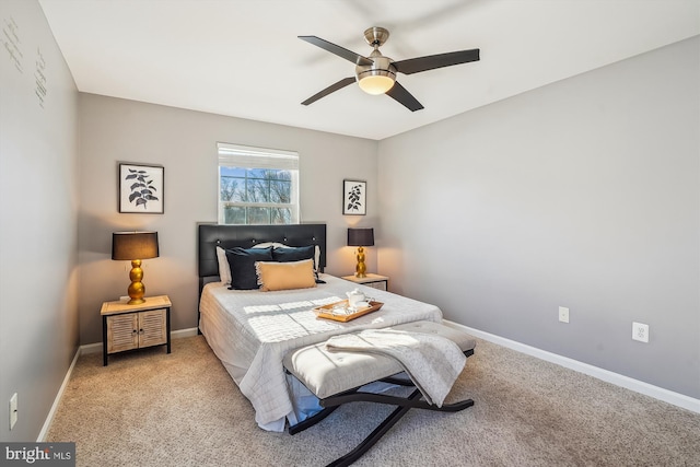 bedroom with ceiling fan and light carpet