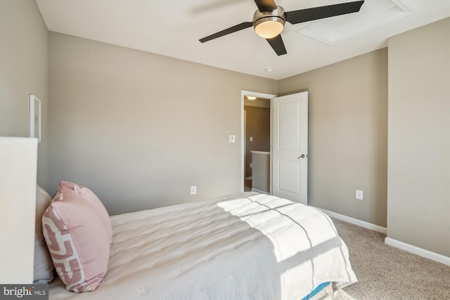 bedroom with ceiling fan and light carpet