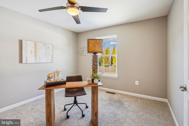 office space featuring ceiling fan and light colored carpet