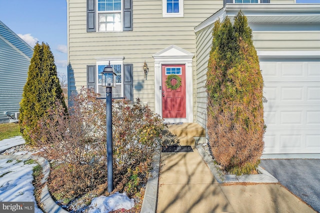 entrance to property featuring a garage