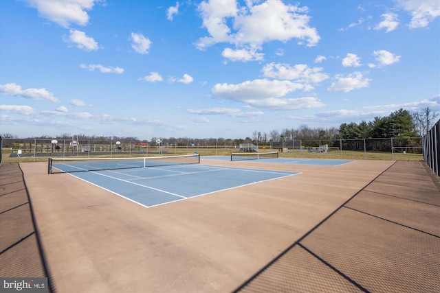 view of sport court featuring basketball hoop