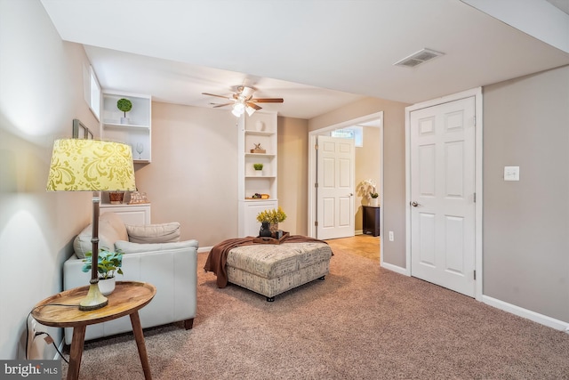 sitting room featuring carpet flooring and ceiling fan