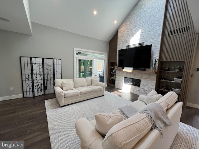 living room featuring a fireplace, high vaulted ceiling, and dark wood-type flooring