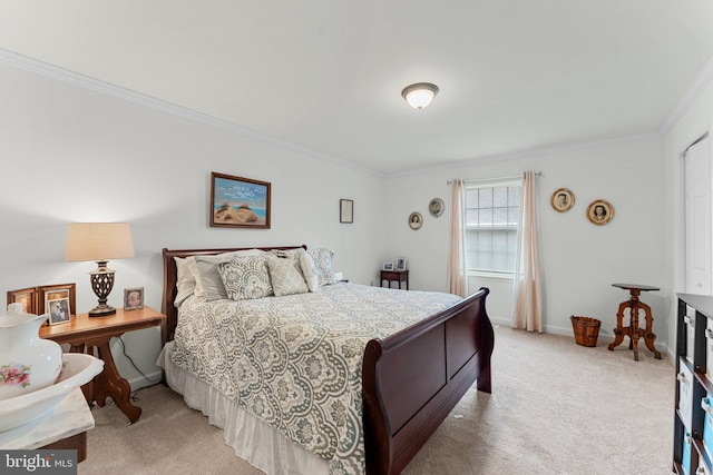 bedroom featuring light carpet, baseboards, and crown molding