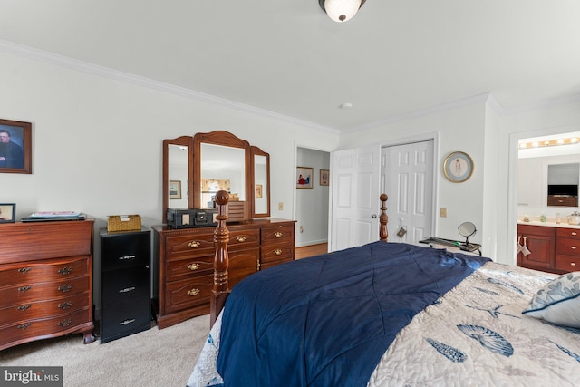 bedroom with light carpet, crown molding, connected bathroom, and a closet