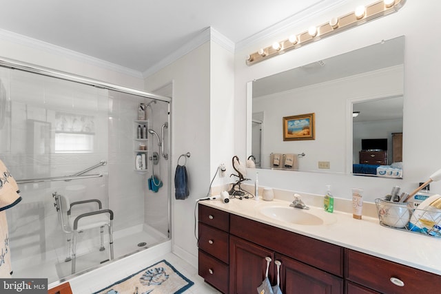 ensuite bathroom featuring ensuite bathroom, ornamental molding, a stall shower, and vanity