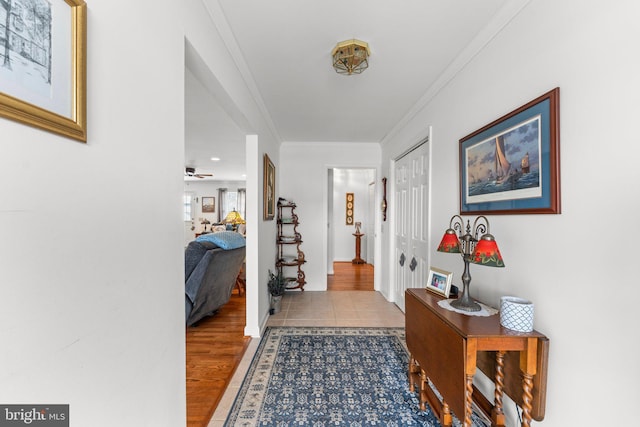 interior space featuring crown molding and wood finished floors