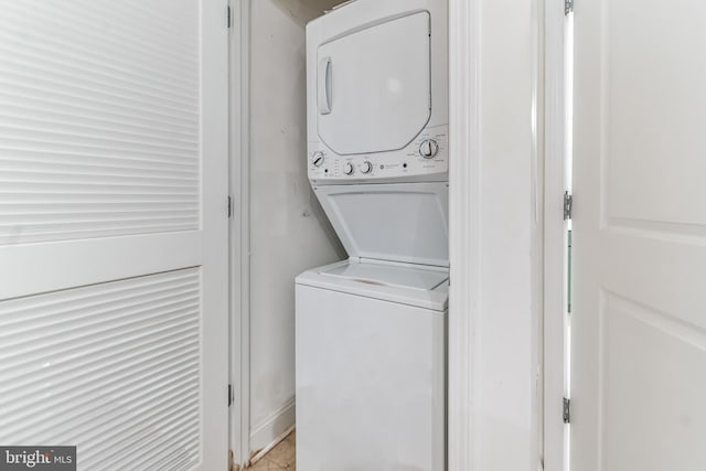 laundry room with stacked washer and dryer