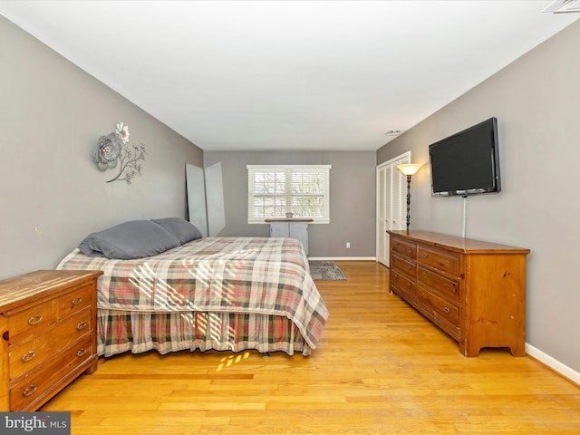 bedroom with light wood-type flooring