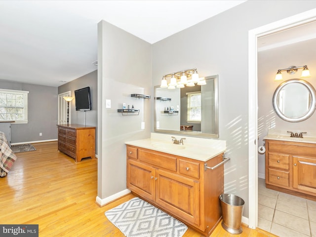 bathroom with vanity and wood-type flooring