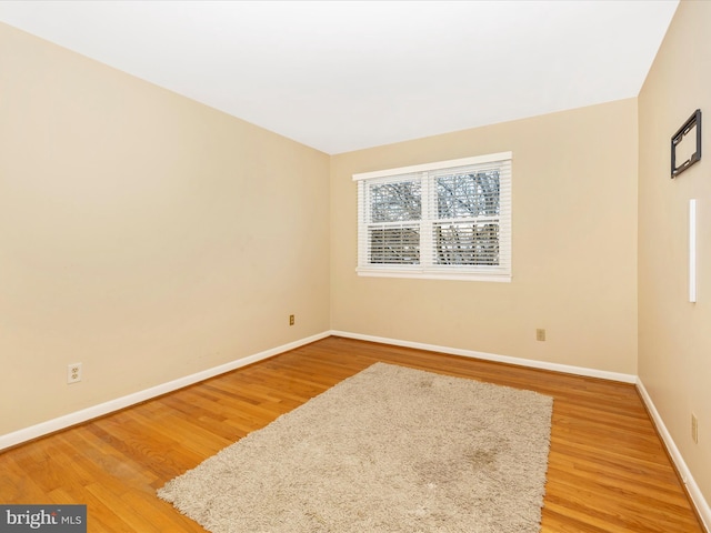 empty room featuring wood-type flooring